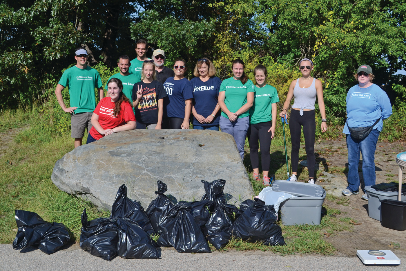 TEAMWORK: In just two hours, 12 volunteers helped remove 86 pounds of trash from Salter Grove. Volunteers came from Save the Bay, Citizens Bank, Jet Blue and elsewhere in the city.